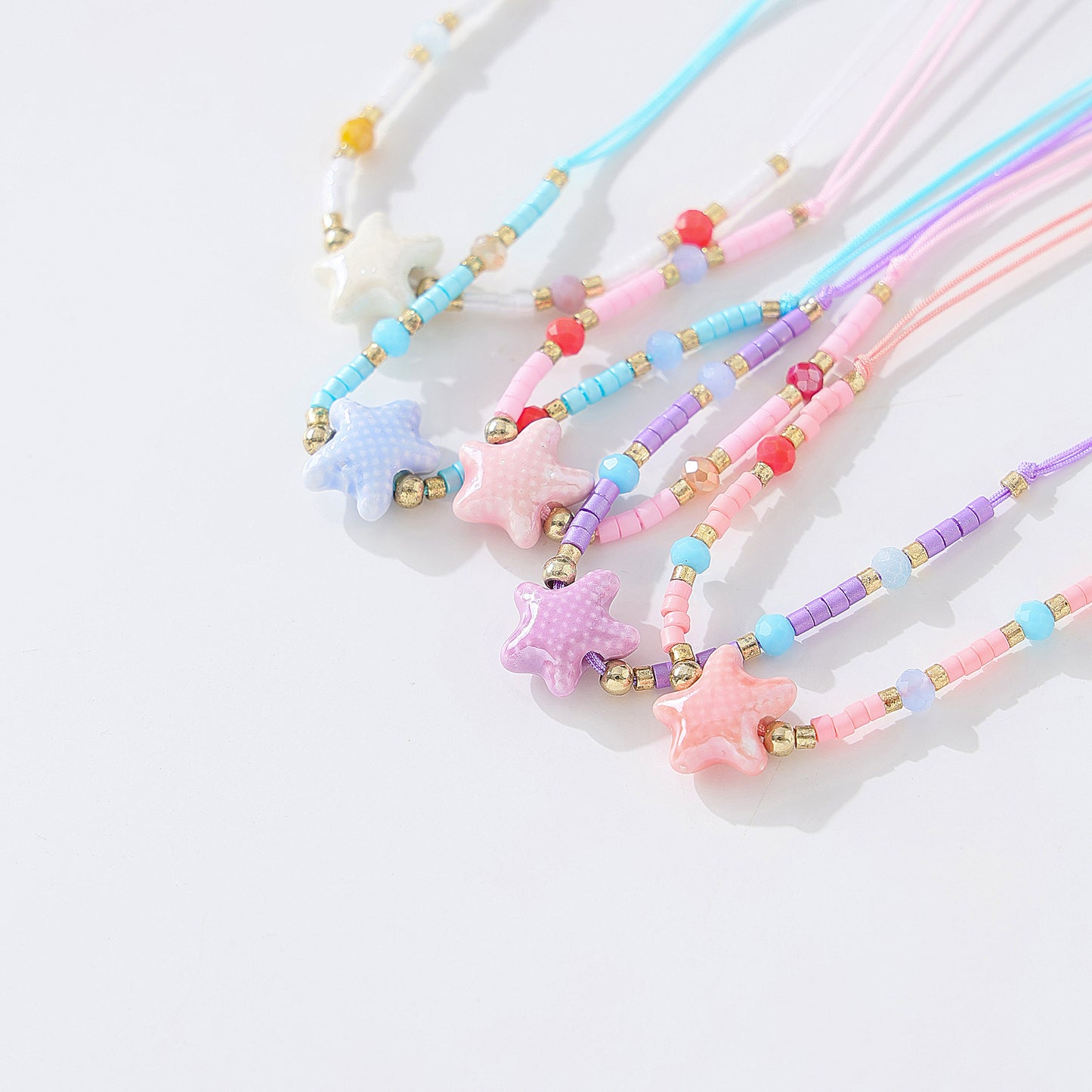 Charming Beaded String Bracelets with Color - Coded Ceramic Starfish Charms for Women and Girls, Handmade Adjustable Bracelets for Beach, Casual, and Party Occasions