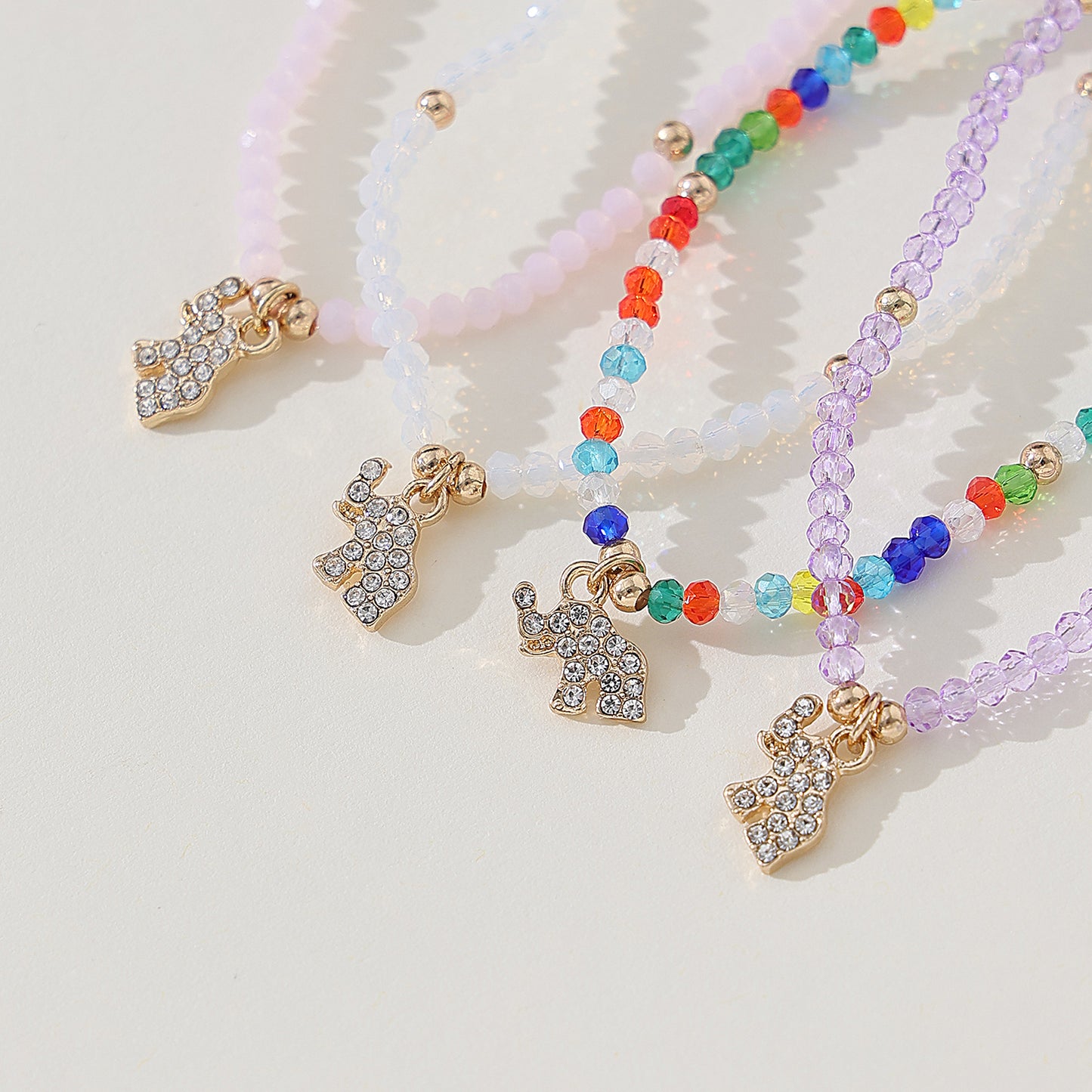 Chic Assorted Beaded Bracelets with Sparkling Crystal Elephant Charms - Perfect for Layering and Gifting