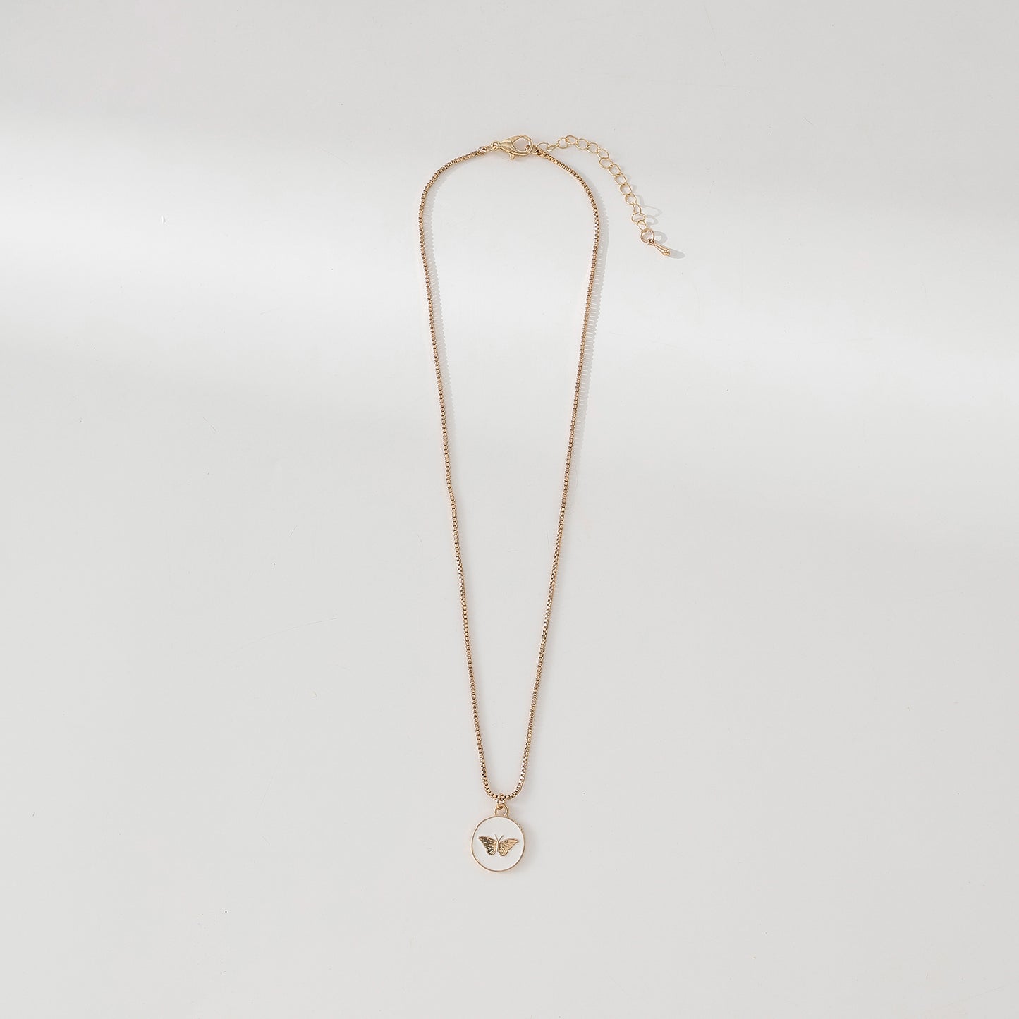 Enchanting Gold - Tone Chain Necklace with Round Enamel Pendants Featuring Delicate Butterfly Designs