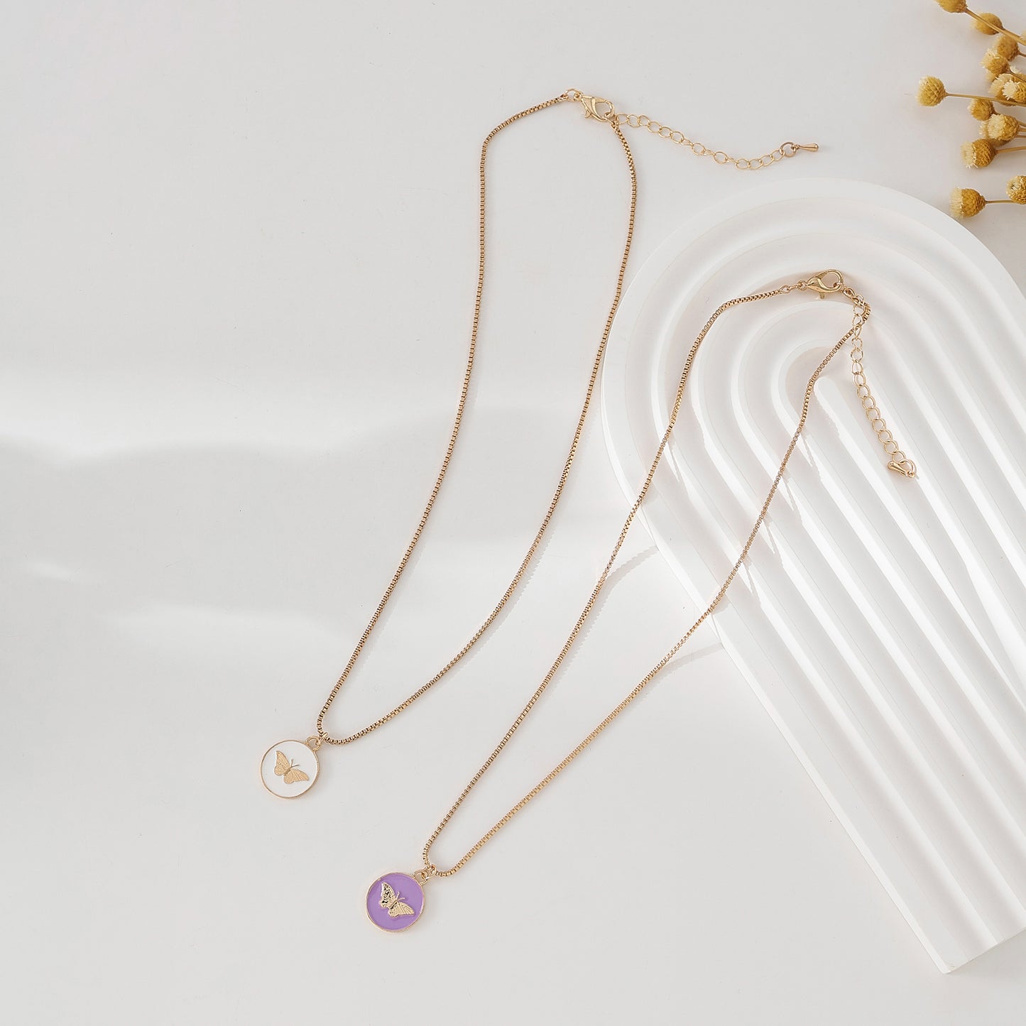 Enchanting Gold - Tone Chain Necklace with Round Enamel Pendants Featuring Delicate Butterfly Designs