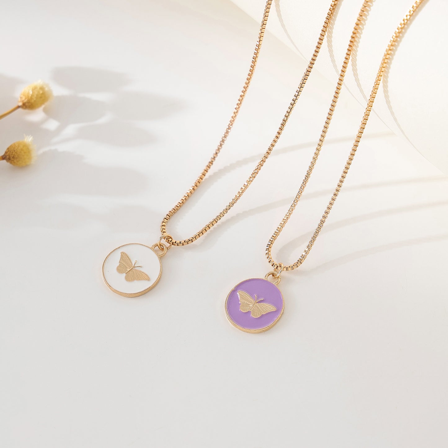 Enchanting Gold - Tone Chain Necklace with Round Enamel Pendants Featuring Delicate Butterfly Designs