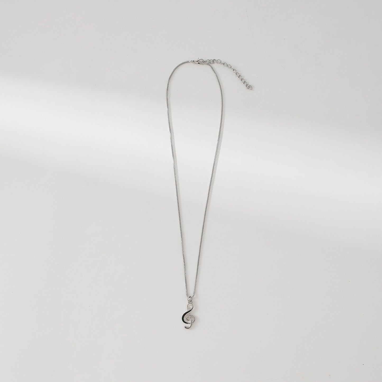 Exquisite Silver Treble Clef Necklace with Black - Accented Charm on Delicate Silver Chain