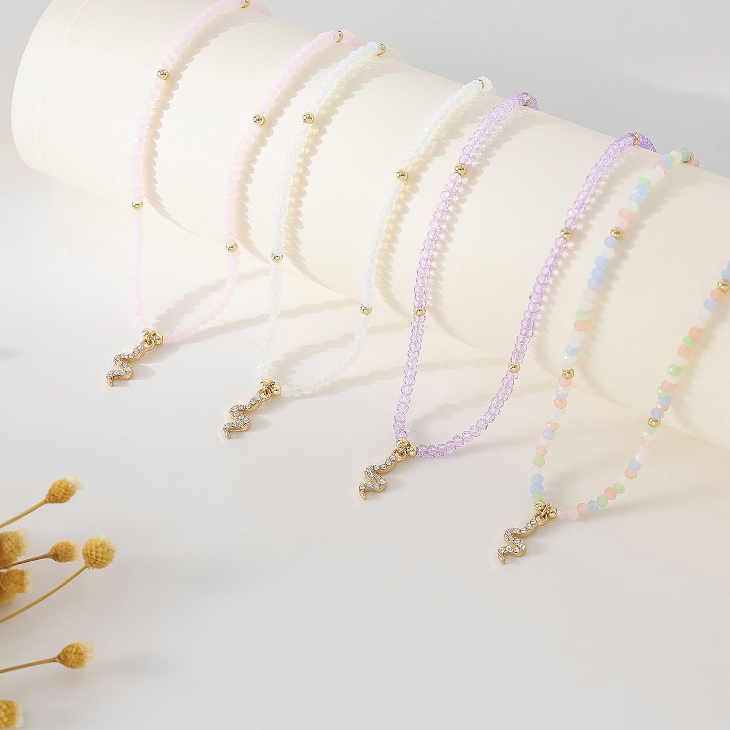 Gold Snake with rhinestones on assorted Beaded Necklace