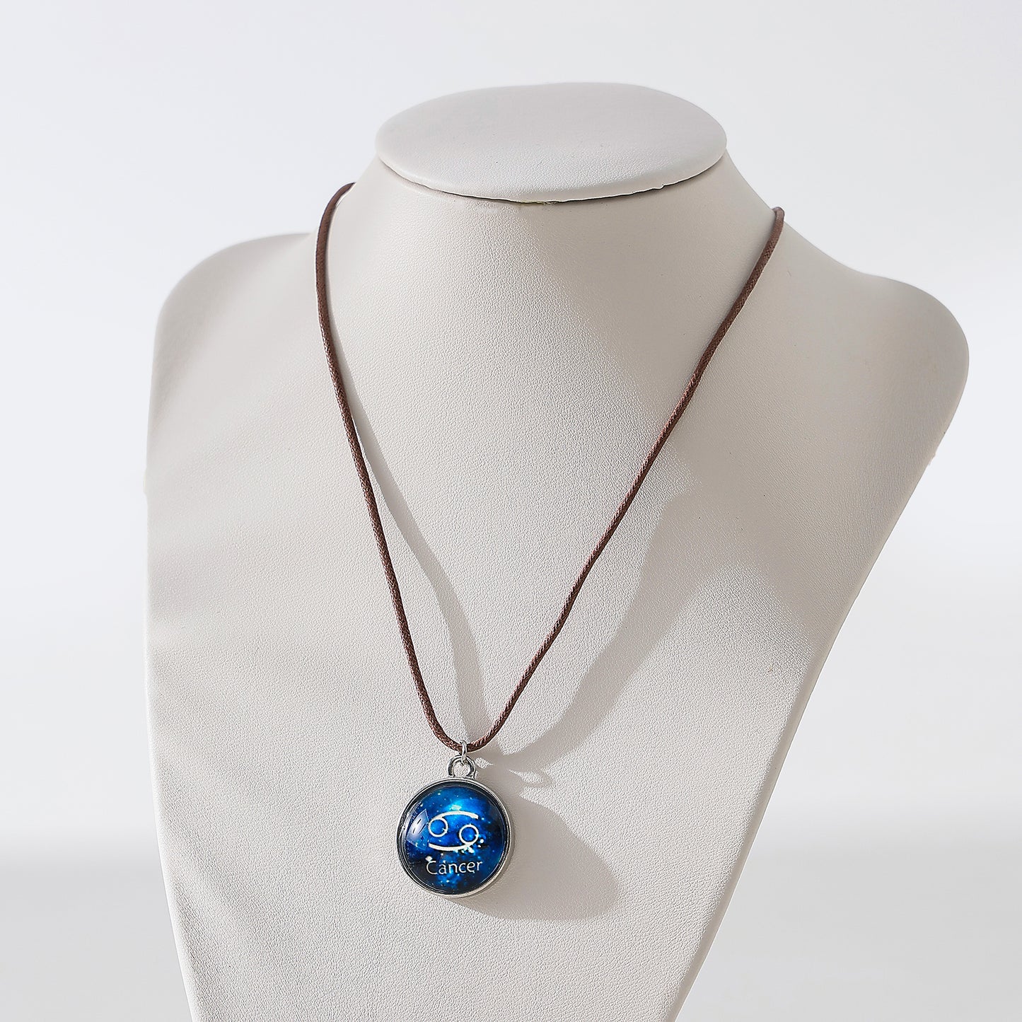 Enchanting Zodiac - Cancer Blue Disk Pendant Necklace on Premium Leather Cord