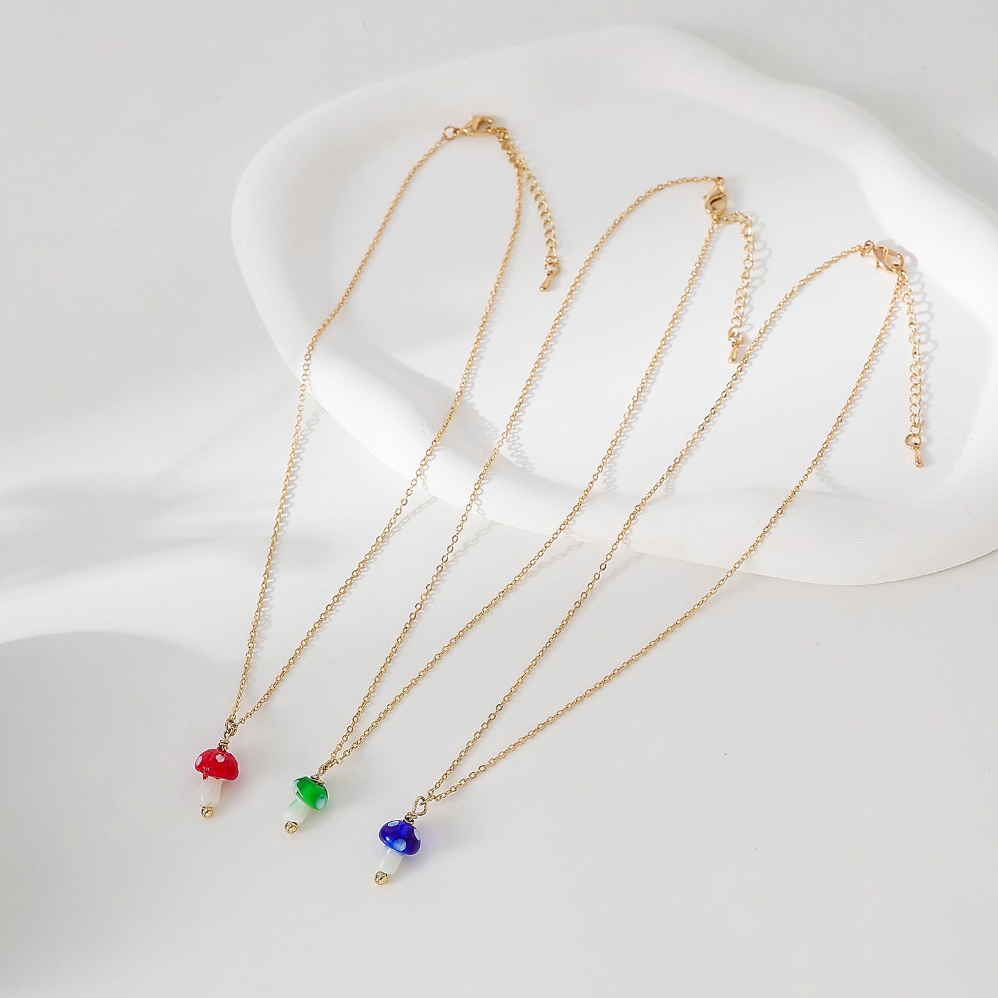 glass Mushroom charm Necklace on a gold chain