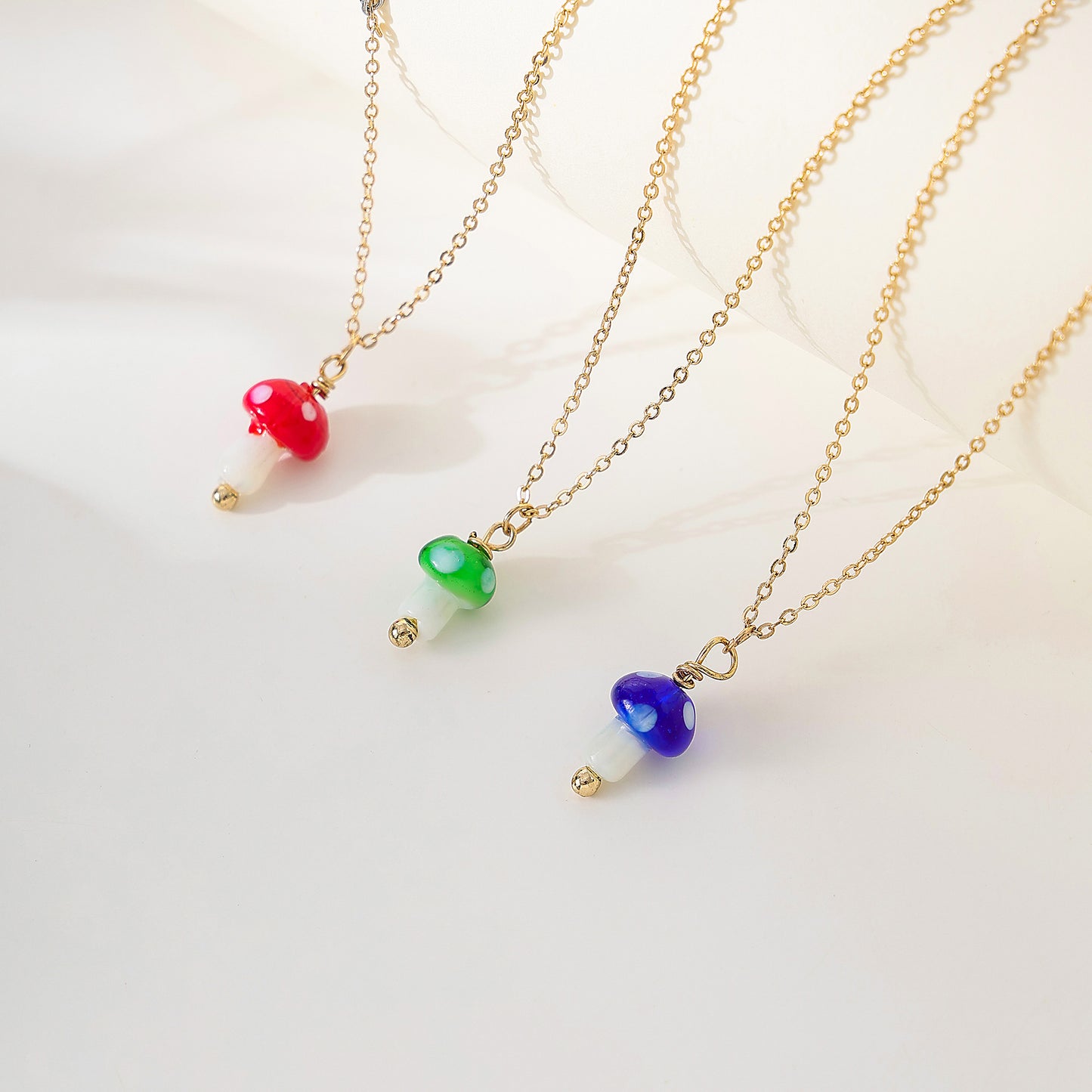 glass Mushroom charm Necklace on a gold chain