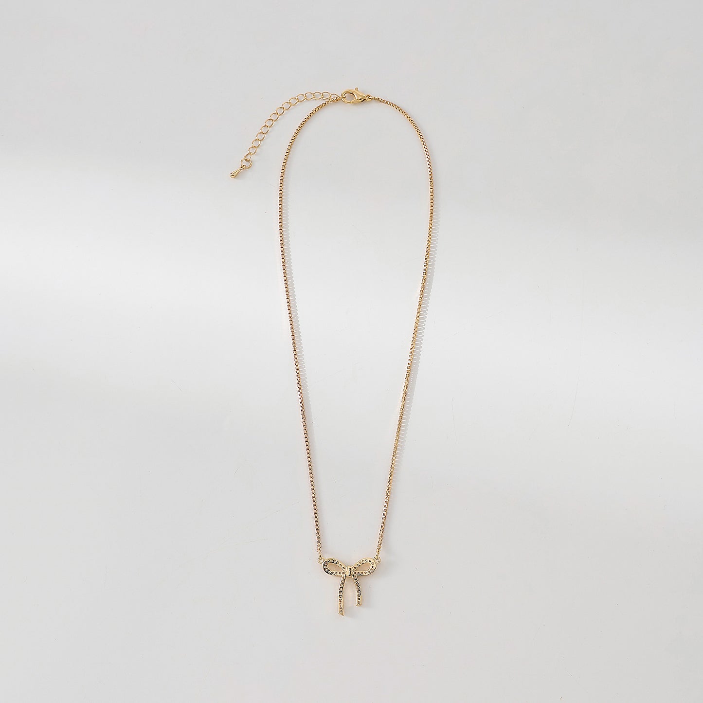 Golden and Crystal Bow Necklace