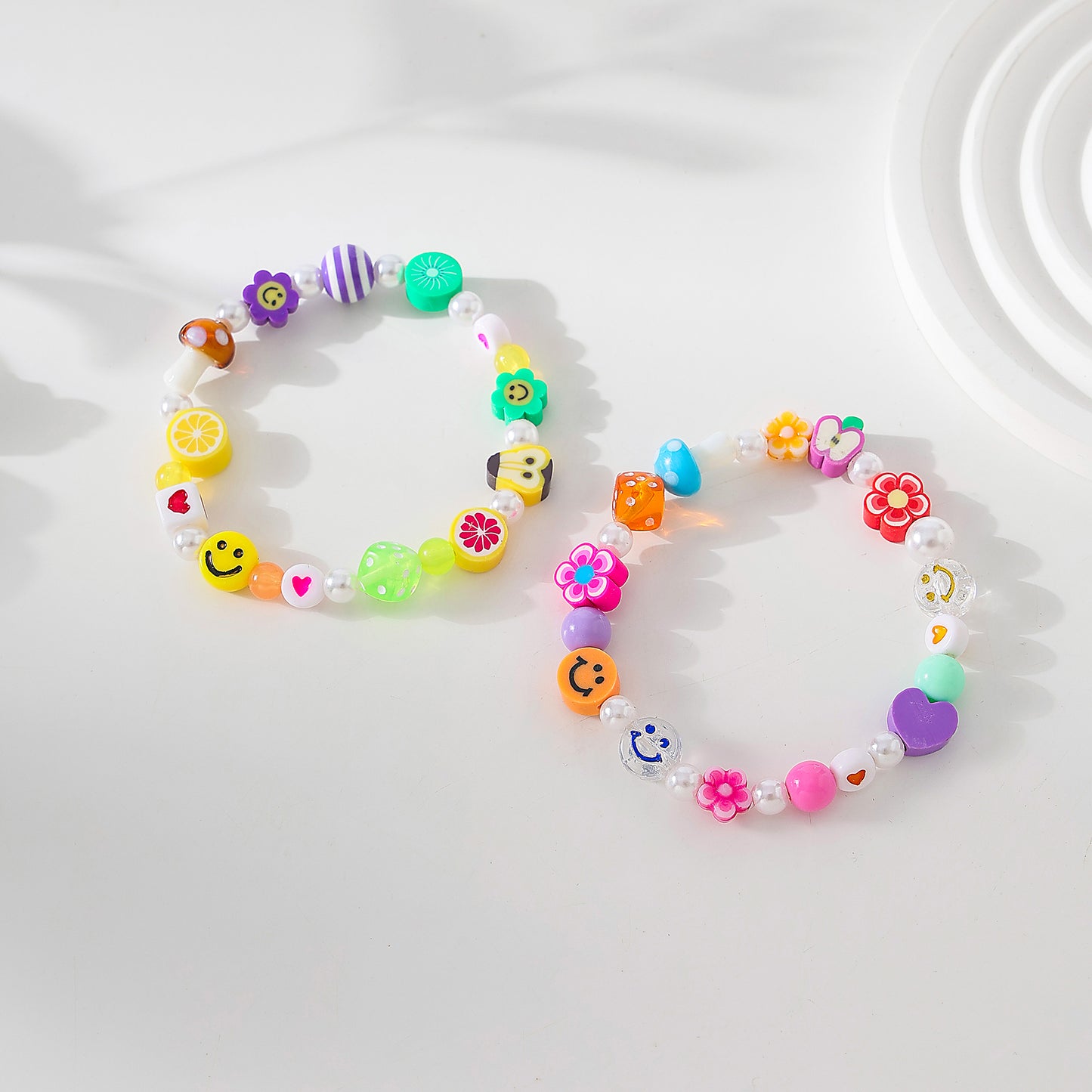 Assorted fimo beads and fake Pearls on elastic bracelet