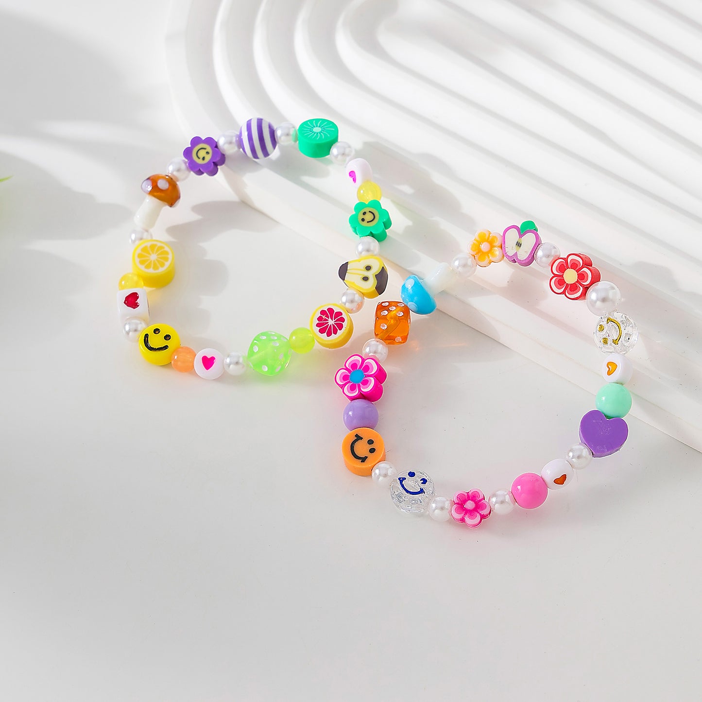 Assorted fimo beads and fake Pearls on elastic bracelet