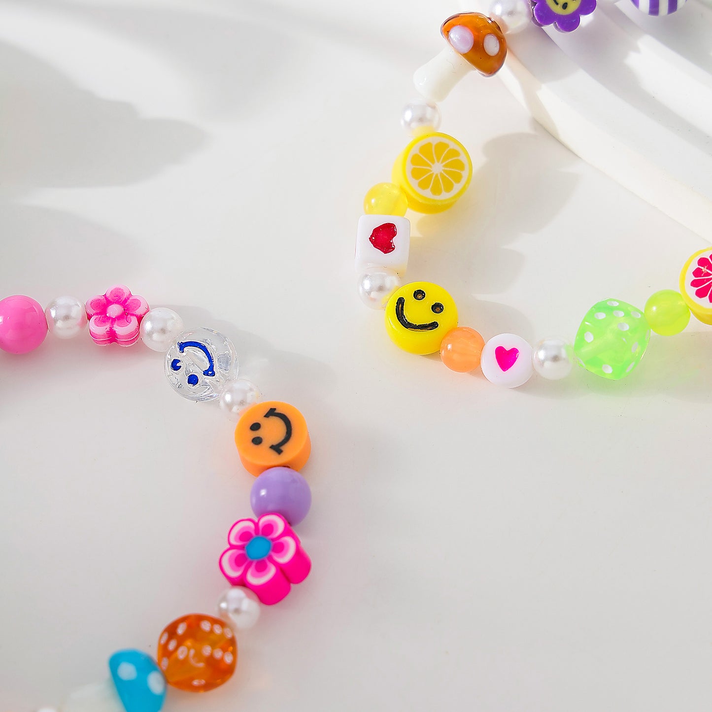 Assorted fimo beads and fake Pearls on elastic bracelet
