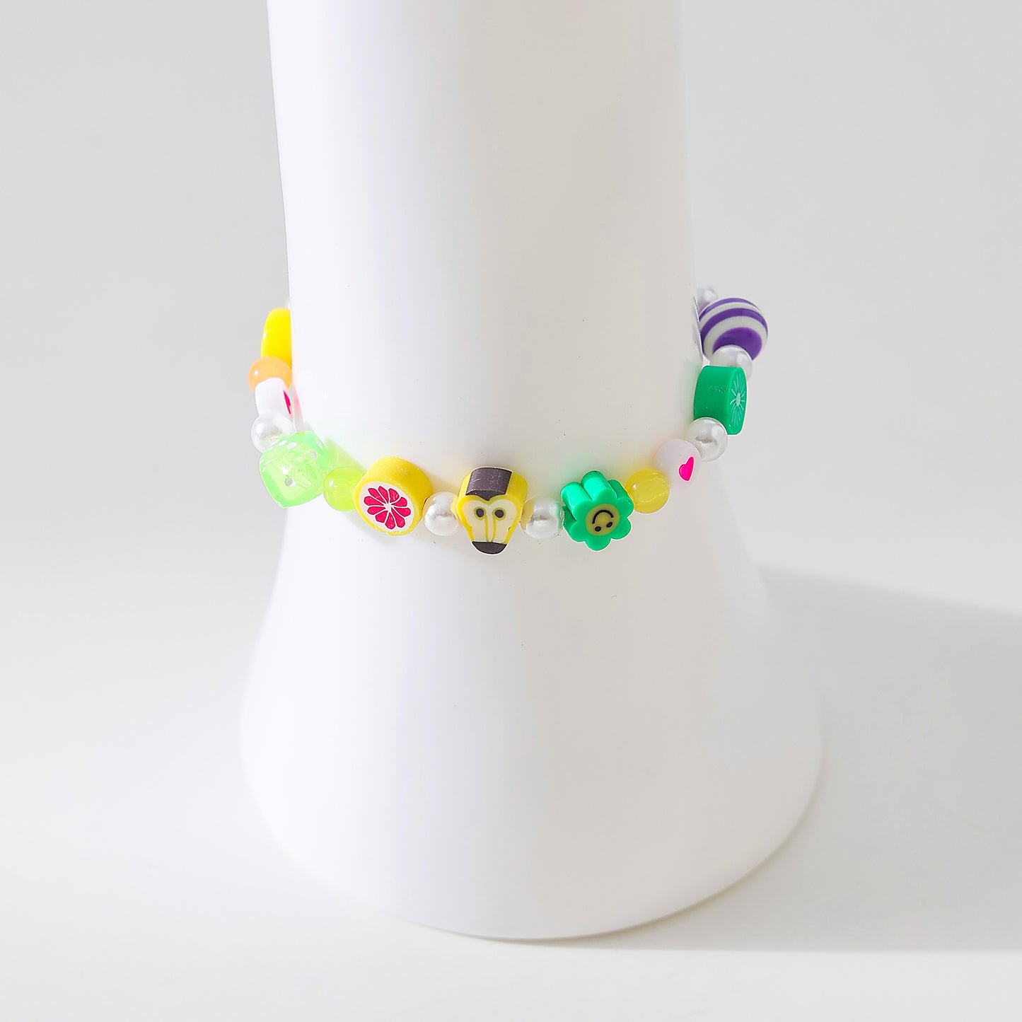 Assorted fimo beads and fake Pearls on elastic bracelet