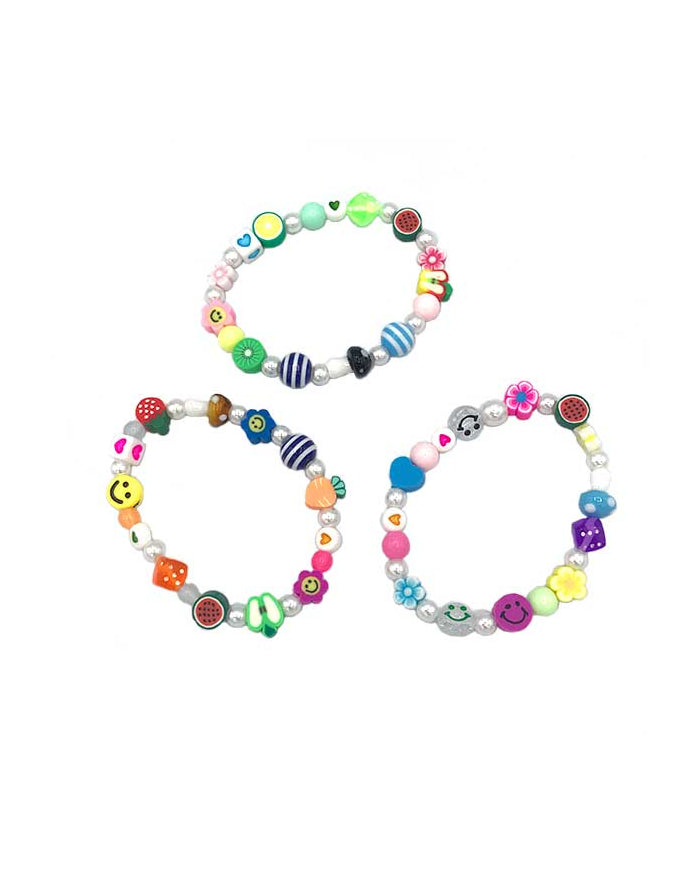 Assorted fimo beads and fake Pearls on elastic bracelet