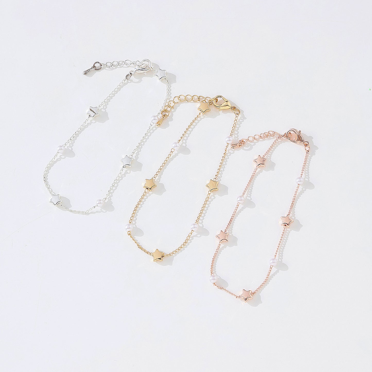 Enchanting Silvery, Golden, and Rose Golden Pearl & Star Charm Bracelets for Women - Perfect for Any Occasion