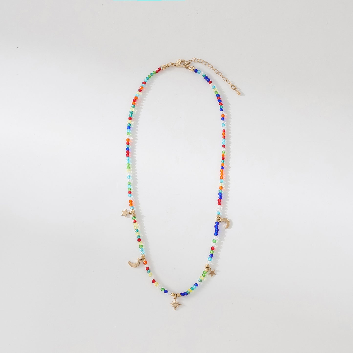 Enchanting 4 - Strand Assorted Bead Necklace with Dainty Moon and Star Charms