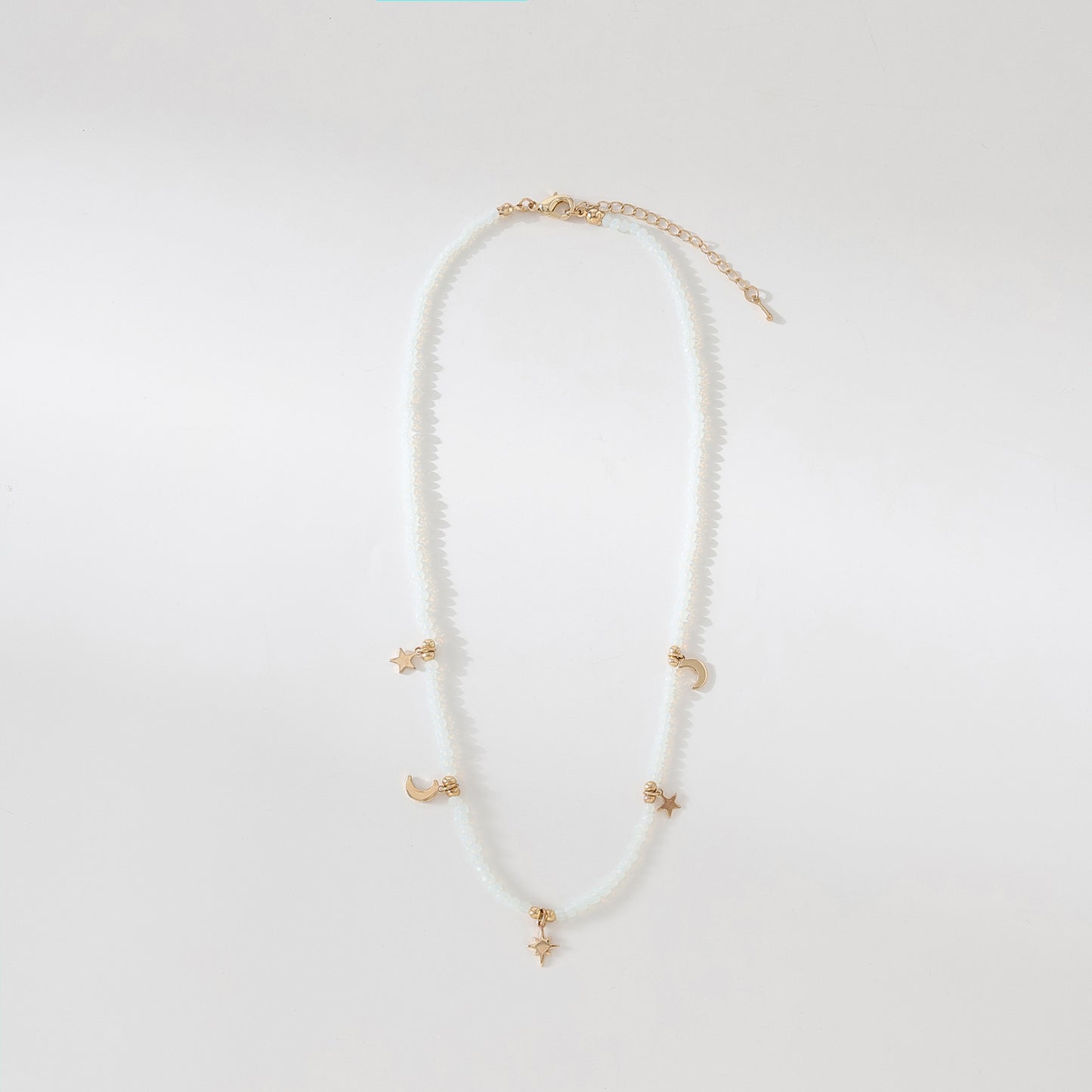 Enchanting 4 - Strand Assorted Bead Necklace with Dainty Moon and Star Charms