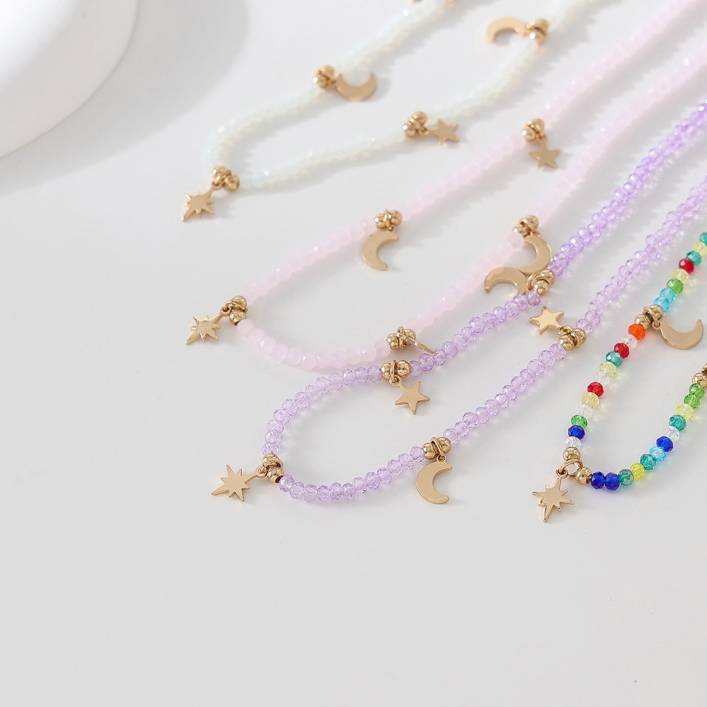 Enchanting 4 - Strand Assorted Bead Necklace with Dainty Moon and Star Charms