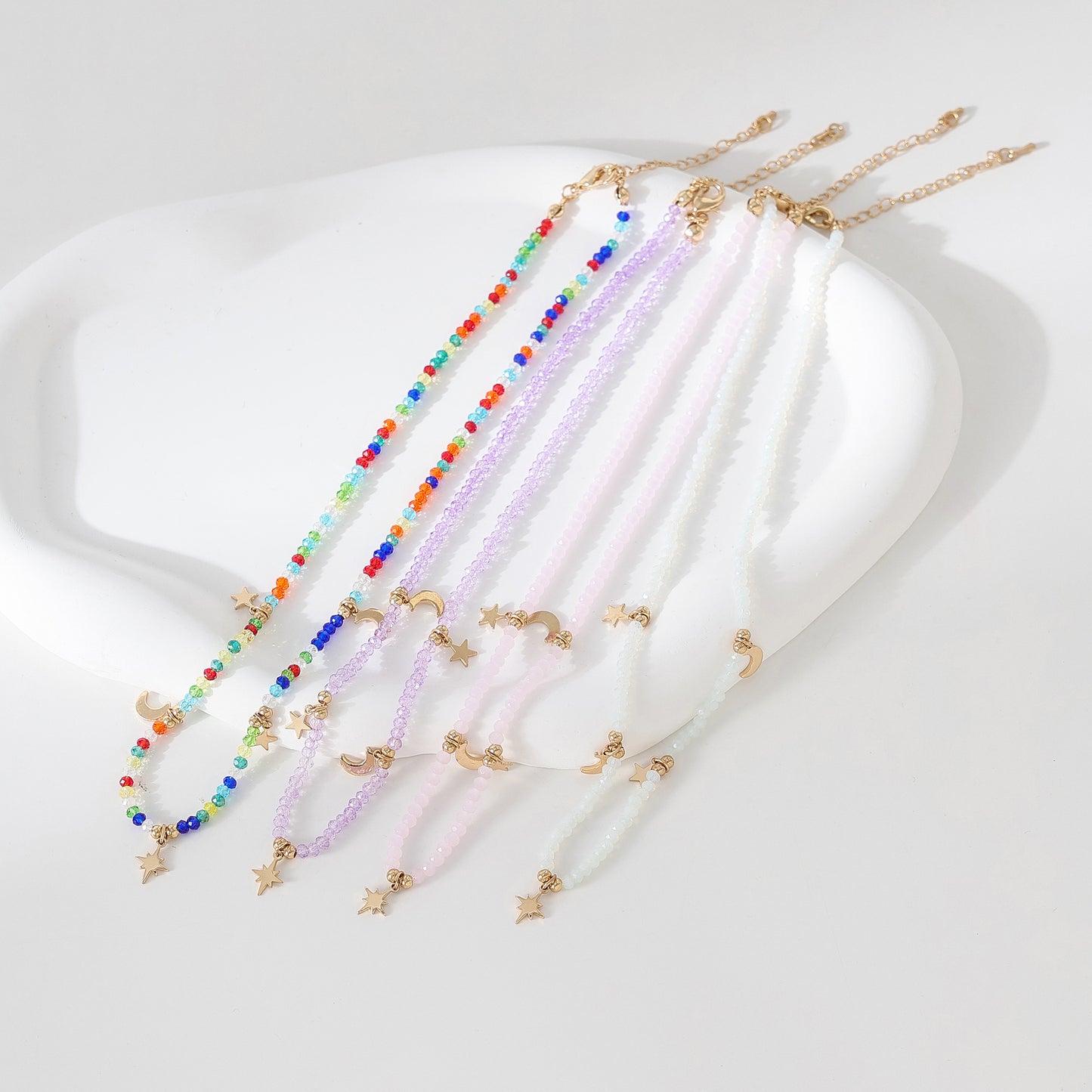 Enchanting 4 - Strand Assorted Bead Necklace with Dainty Moon and Star Charms
