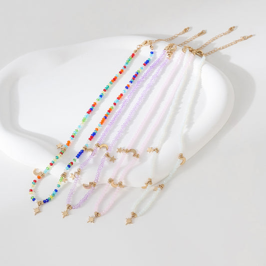 Enchanting 4 - Strand Assorted Bead Necklace with Dainty Moon and Star Charms