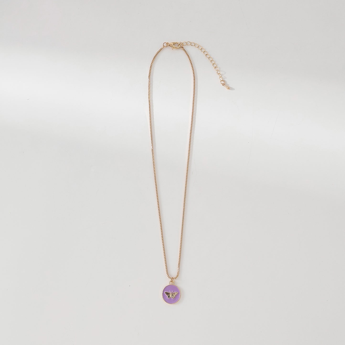 Enchanting Gold - Tone Chain Necklace with Round Enamel Pendants Featuring Delicate Butterfly Designs