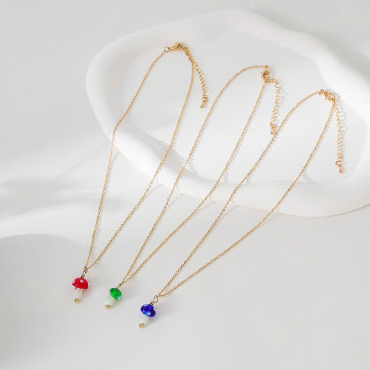 glass Mushroom charm Necklace on a gold chain